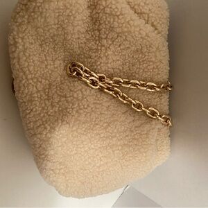 - Off white Sherpa purse with gold chain strap